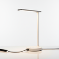 Modern LED desk lamp with USB charging port on white background